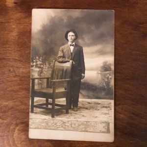 photo of youth in suit and hat on postcard